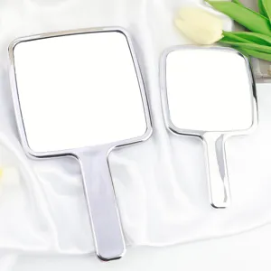 Miroir de maquillage à main détail, magnifique miroir cosmétique argenté portable.