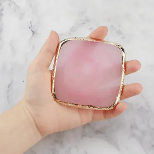 Square resin agate nail art palette with gold edge for manicure color mixing and display.