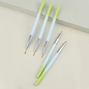 Close-up view of professional nail art brush set featuring gradient design and fine tips.