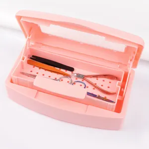 Pink plastic nail art disinfection box with inner filtering tray for clean tools storage detail.
