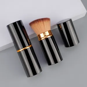 Tragbarer Teleskop-Pinsel, schwarzer und goldener Puderpinsel fuer ein makelloses Make-up.