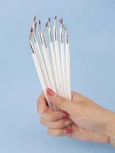 Fine angled eyeliner brush detail makeup tool with soft synthetic hair and white handle.