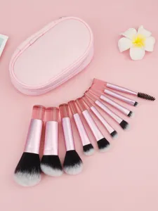 Detailed view of 10pcs mini travel pink makeup brush set featuring soft bristles and storage bag.