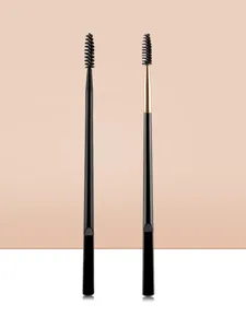 Professional dual-ended eyebrow brush and spoolie for precise makeup application and shaping.