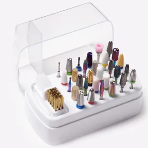 Close-up detail of a 30-hole nail drill bit storage box with various bits and cleaning brush.