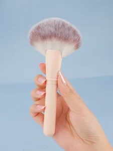 Large fan makeup brush detail view, soft synthetic bristles for highlighter and setting powder.