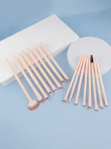 Detailed view of the 16-piece makeup brush set with soft pink handles and fine synthetic bristles.