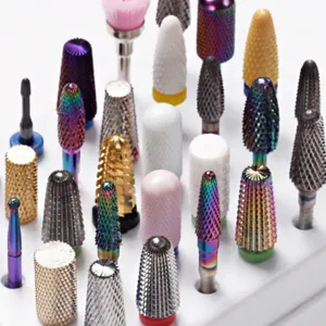 Professional nail drill bits set, assorted shapes and materials for manicure and pedicure.
