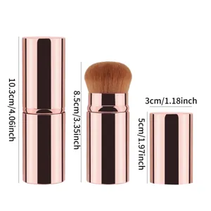 Portable retractable makeup brush with rose gold metallic case, professional cosmetic tool.