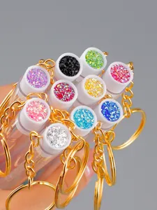 Bunte Glitzer Make-up Pinsel Schlüsselanhänger mit transparenten Tuben und Goldketten.