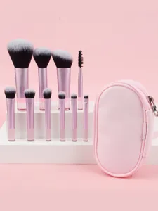 Detailed close-up shot of portable pink mini makeup brush set featuring storage pouch for travel.