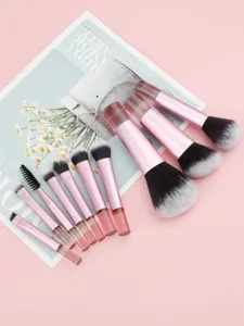 Detailed view of 10-piece mini travel makeup brush set with pink handles.