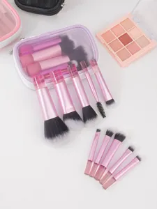 Vista detallada del juego de 10 brochas de maquillaje rosas con bolsa de malla y paleta.