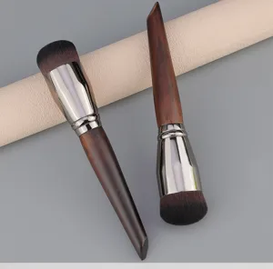 Professional round foundation brush with wooden handle and dense bristles for flawless makeup application.