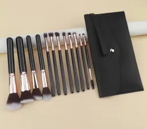Professional 12-piece black gold makeup brush set with soft bristles and storage pouch.