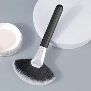 Large black handle fan makeup brush synthetic hair highlighter and excess powder sweep tool.