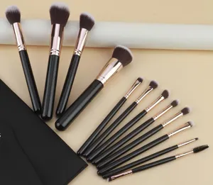 Detail view of 12pcs black gold makeup brush set with storage bag and soft synthetic bristles.