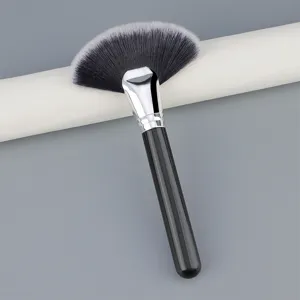Professional large fan makeup brush with soft synthetic fibers and sleek black handle for highlighter.