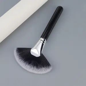 Large black handle fan makeup brush, soft synthetic fibers for highlighter and powder application.