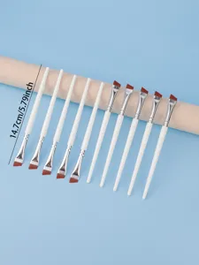 Fine angled eyeliner brush set with white handle, detail makeup brush for professional use.