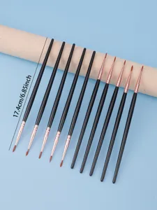 Fine eyeliner brush detail with black handle and rose gold ferrule for precise makeup.