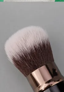 Detailed view of the soft synthetic makeup brush head with dense bristles and metallic ferrule.