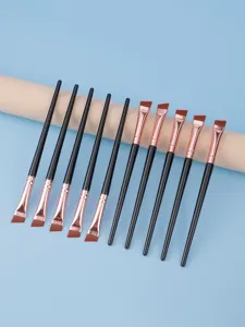Fine angled eyeliner brush detail shot, synthetic fiber hair for precise eye makeup use.