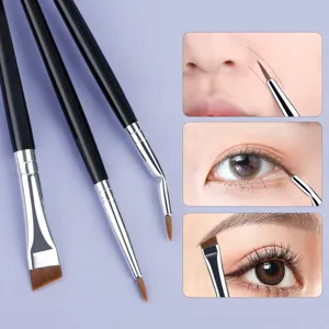 Detail view of fine angled eyeliner brush and precision detail makeup brush usage.