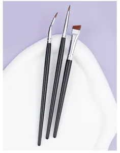 Fine angled eyeliner brush set with bent tip and slanted brow brush for precise eye makeup.