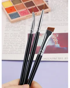 Fine detail eyeliner brush set close up showing angled and bent tips for precise makeup application.