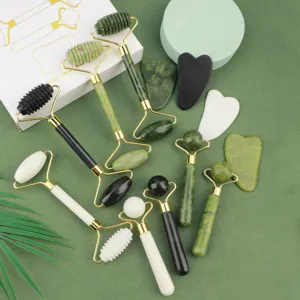 Jade roller and gua sha set for facial massage, natural stone beauty tools gift box display.