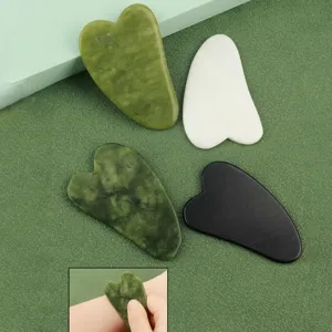 Set of 4 heart shaped stone Gua Sha face scraping massage tools for daily skincare beauty routine