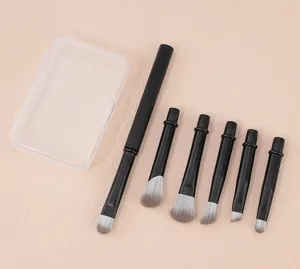 Portable mini travel makeup brush set with replaceable brush heads for eyes and nose details.