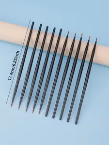 Detail view of fine black handled detail brushes arranged neatly for precise makeup application.
