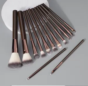 Detailed close-up of brown makeup brush set showing soft synthetic bristles and handle.