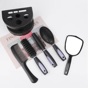 Detailed view of black hair styling comb and mirror set parts showing neat bristles.