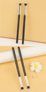 Professional makeup brush set for blending eyeshadow and highlighting with soft bristles.