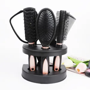 Black hair brush set with stand mirror and combs, professional styling hair tool detail view.