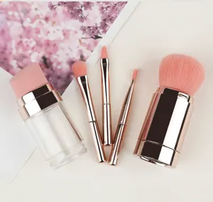 Vue détaillée de l'ensemble de pinceaux de maquillage portables 5 en 1 avec des manches dorés.