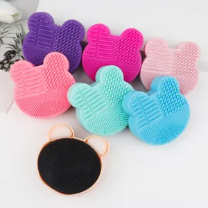 Silicone makeup brush cleaning pad detail view, cute shape, multi-color cosmetic cleaning tool.