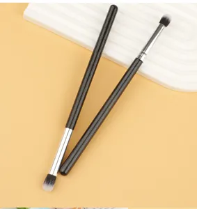 Detail view of soft makeup brush for eyeshadow and highlighter, professional blending tool.