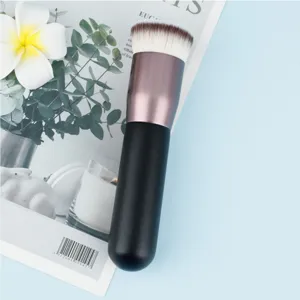 Flat top makeup brush for smooth liquid foundation application and daily makeup use.