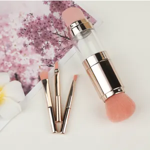 Set de pinceaux de maquillage portables 5 en 1 voyage avec manche en metal or rose et poils roses.
