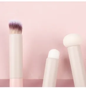 Professional small round concealer brush and lip brush for flawless makeup application.