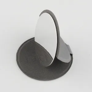 Detail view of portable stainless steel folding makeup mirror showcasing fine texture.