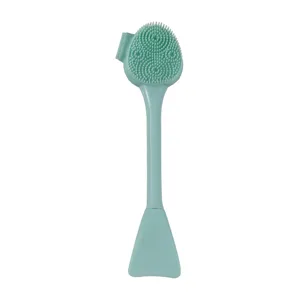 Siliconen gezichtsmaskerborstel en reinigingsborstel detailweergave, mintgroen make-up hulpmiddel.
