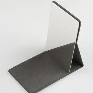 Portable folding stainless steel mirror detail, compact tabletop stand design for daily use.
