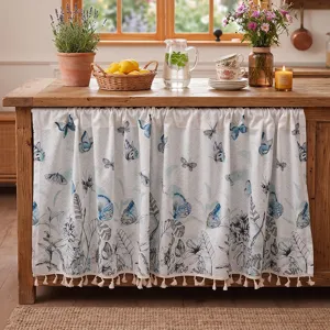 Rustic cafe curtain with blue butterfly botanical print and tassel trim for country kitchen decor.