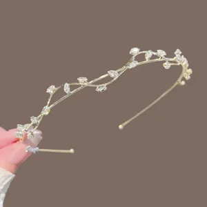 Gold rhinestone vine headband for women, elegant leaf hair hoop for wedding party.