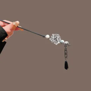 Elegant Chinese style hair stick with metal flower and tassel pendant for women.